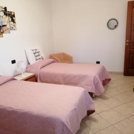 Camere da letto (foto Booking, Sa Domo Tua)
